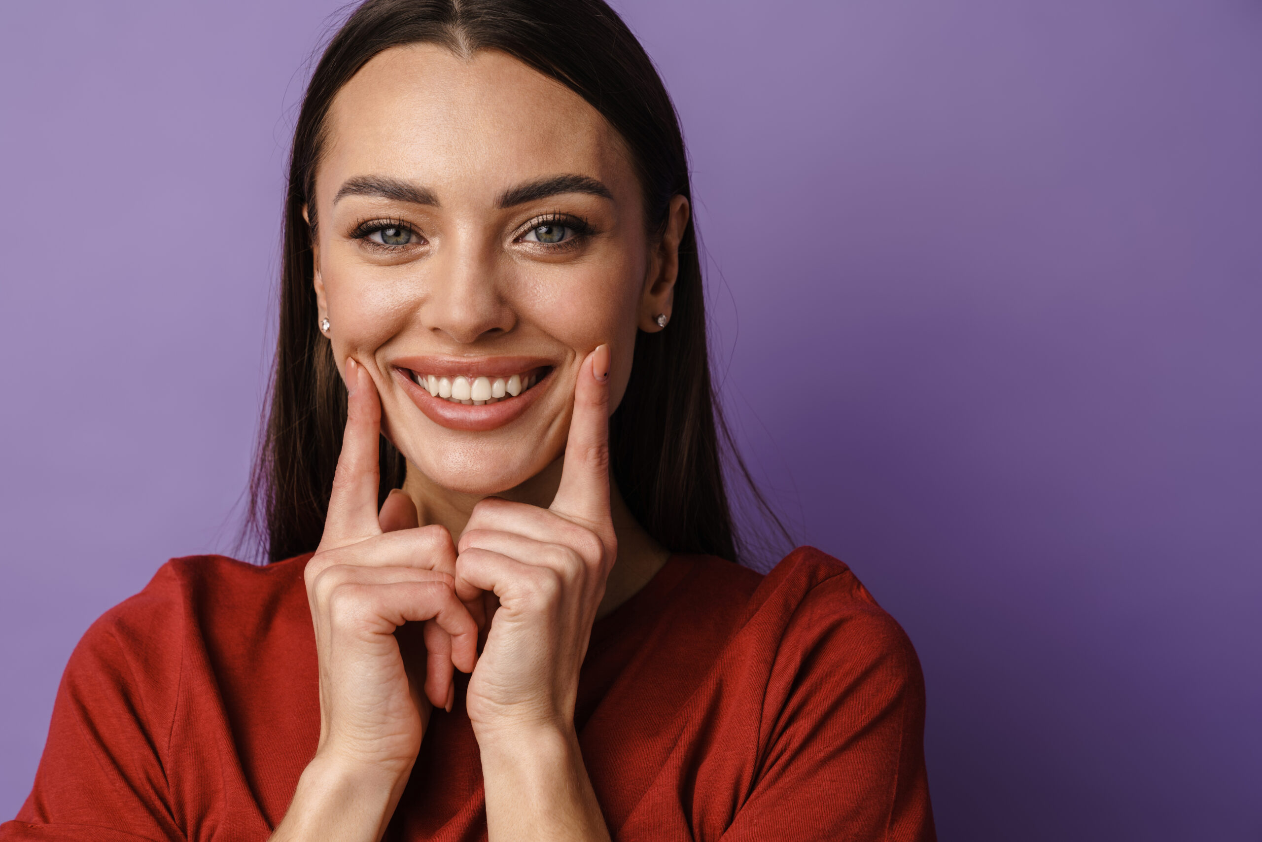 Young woman showing a confident smile with bright, evenly shaped teeth