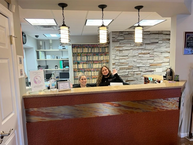 Reception desk with receptionists sitting