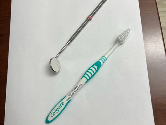Dental mirror tool used during a checkup at Adult & Pediatric Dental Studio