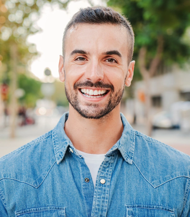 Smiling adult patient receiving dental care at Adult & Pediatric Dental Studio
