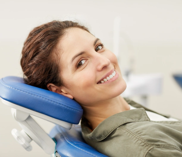 Smiling adult patient during their first visit at Adult & Pediatric Dental Studio