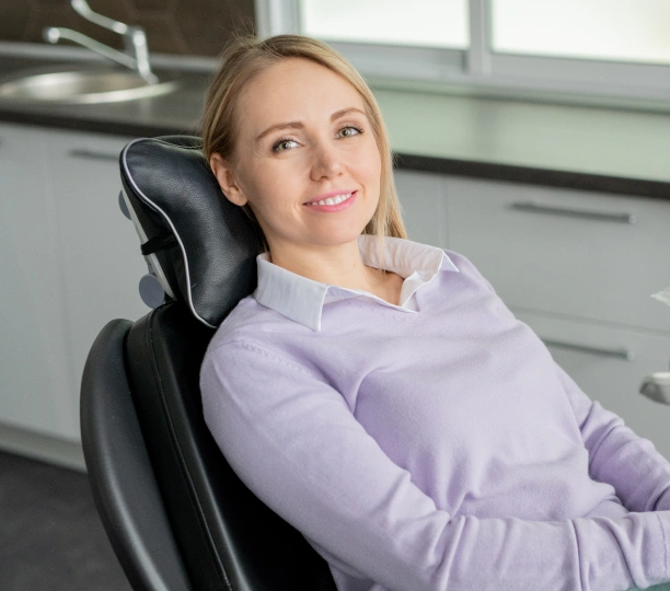 New patient smiling in the dental chair at Adult & Pediatric Dental Studio