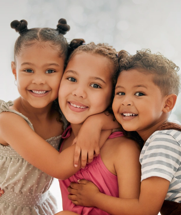 Young girls smiling after pediatric dental care at Adult & Pediatric Dental Studio