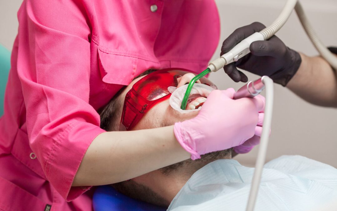 Dentist performing a routine dental checkup in Monroe NJ