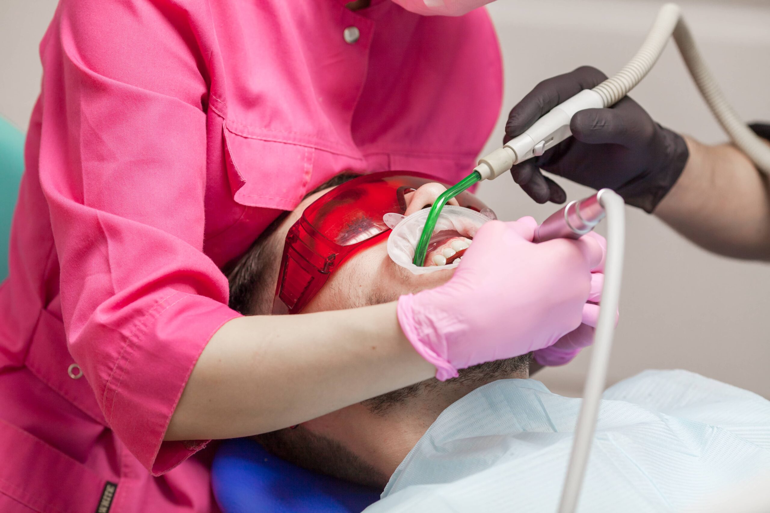 Dentist performing a routine dental checkup in Monroe NJ