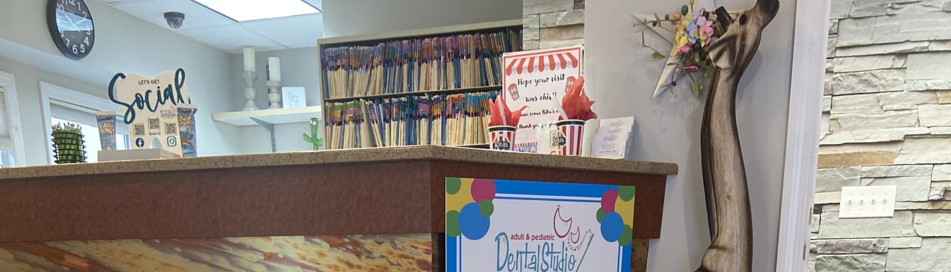 A welcoming view of the check-in counter at a pediatric and adult dental practice