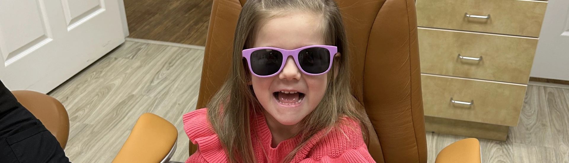 A happy child patient at Adult & Pediatric Dental Studio