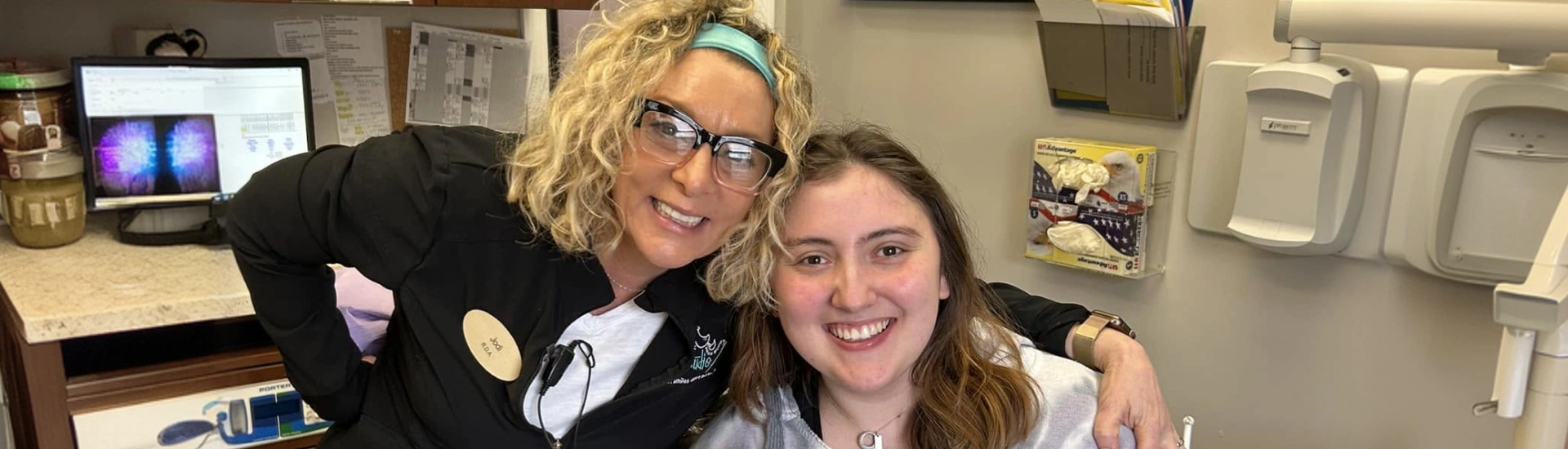 Adult & Pediatric Dental Studio team member and a smiling new patient