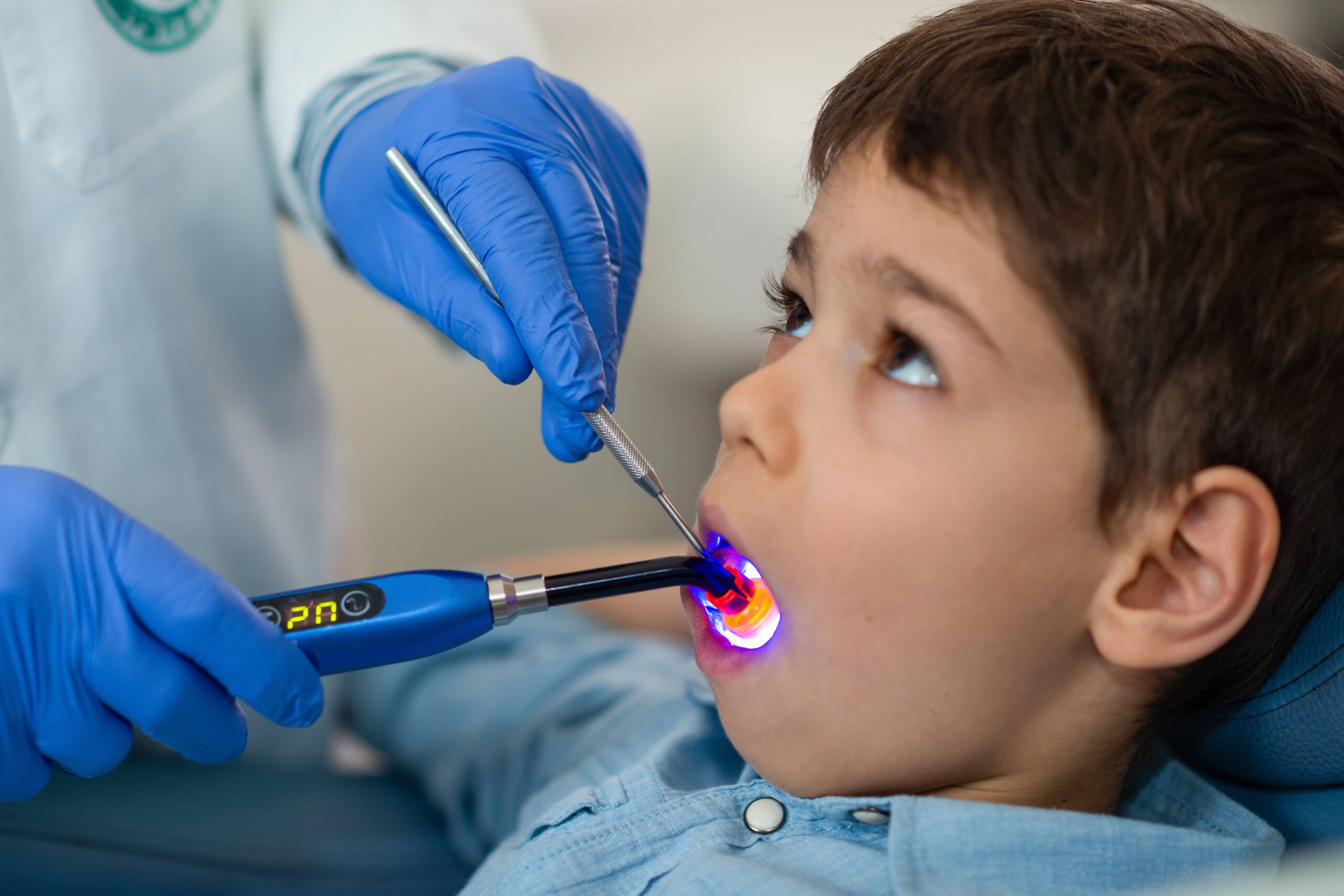 Child smiling in dental chair at a pediatric dentist office in Monroe NJ