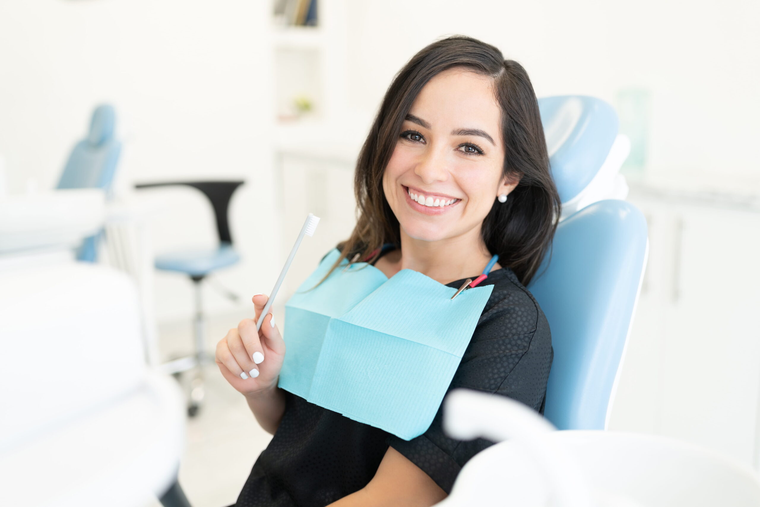 Cosmetic dentist in Marlboro repairing a chipped front tooth with dental bonding